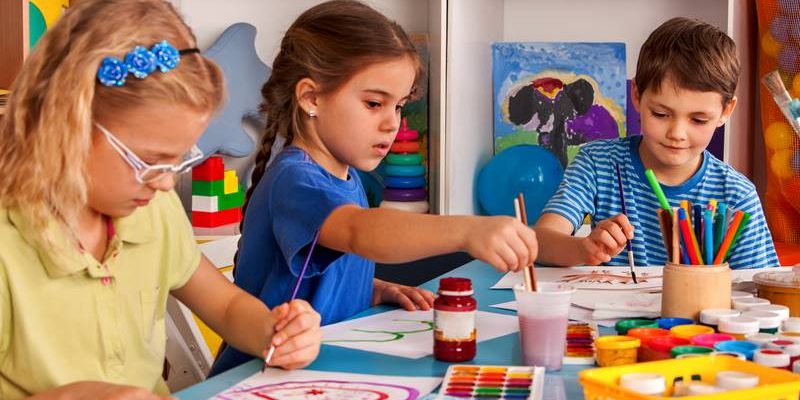 older children painting and making art