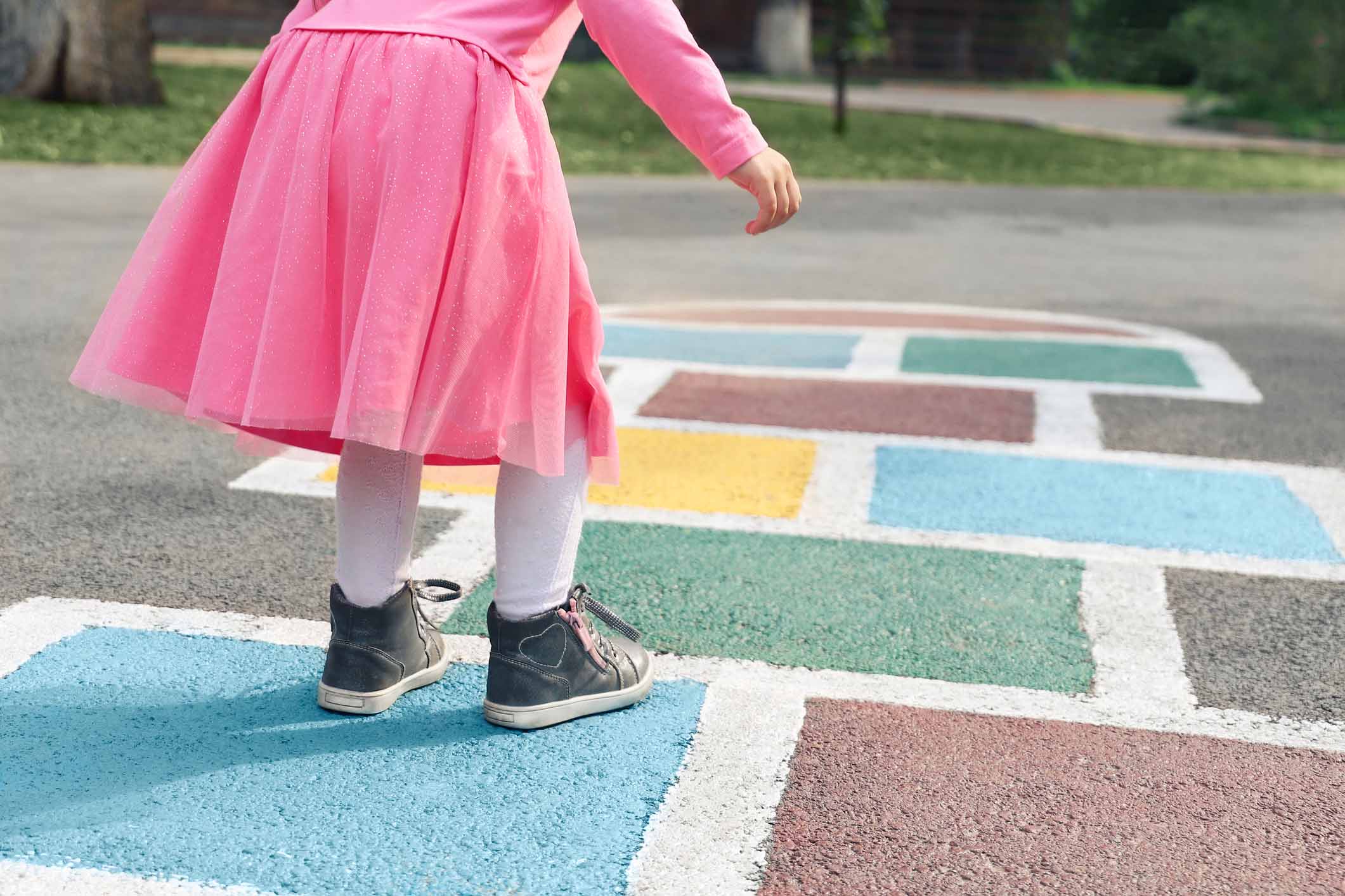 Girl Playing Hopscotch | Nursery In Enniskillen | Daycare | Outdoor Play Areas | Preschool | After School Club | Holiday Club